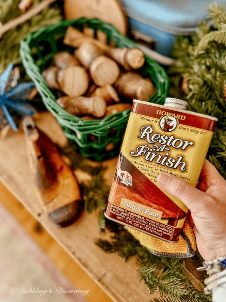 Restor-A-Finish can in Pine Finish in hand.